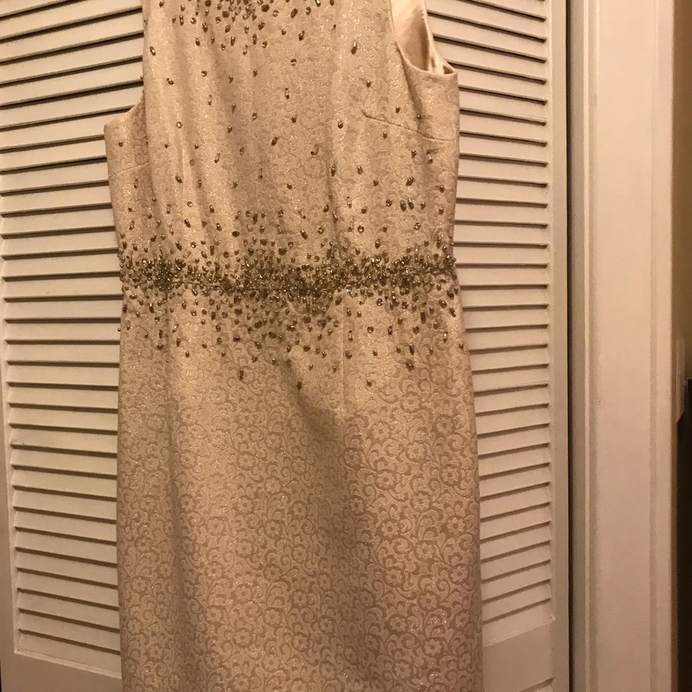 Beaded dress. No tags but never worn. Size 12.